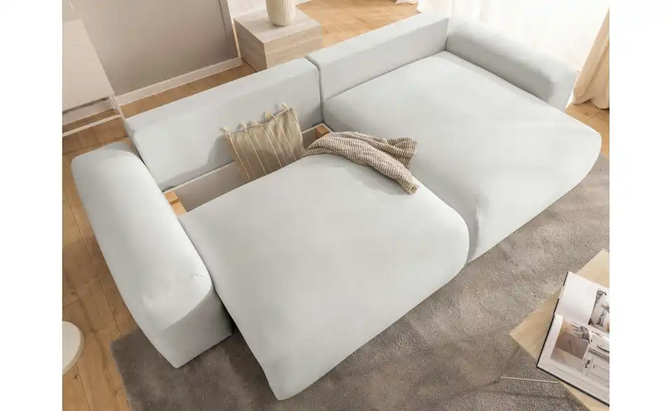 S-STYLE Ecksofa Puffy mit Schlaffunktion, in Wohnsituation